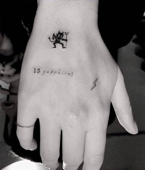 Devil tattoo on palm