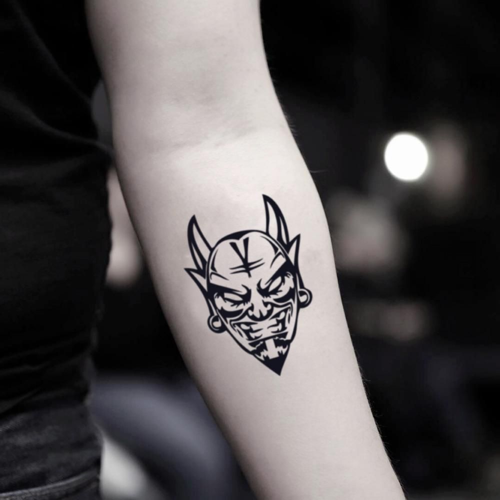 Devil head tatto on arm