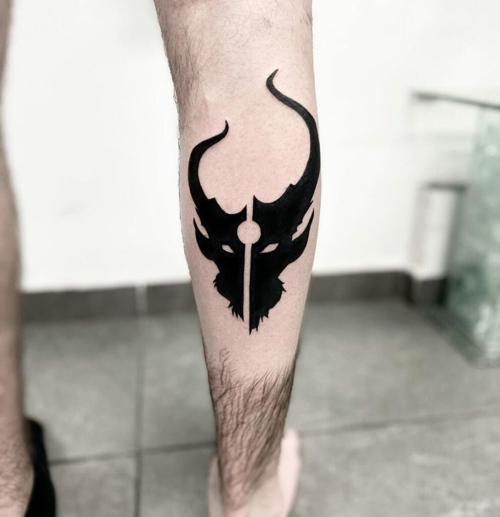 Warrior devil head tattoo on calf