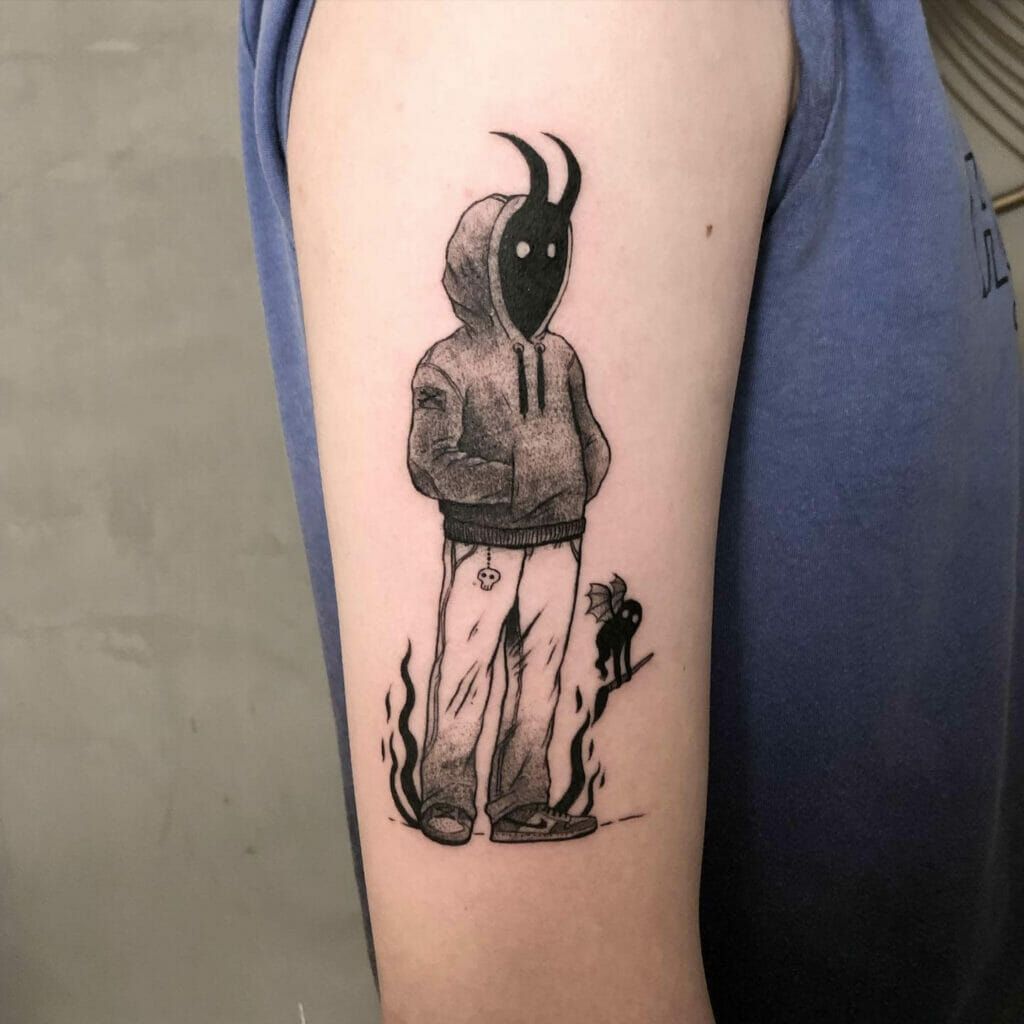 Carton devil tattoo on upper arm for male