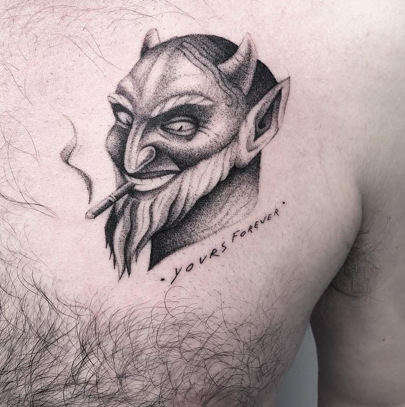 Smoking devil tattoo on chest for man